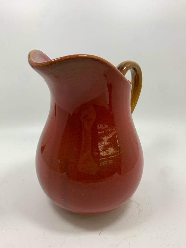 RED CERAMIC PITCHER.