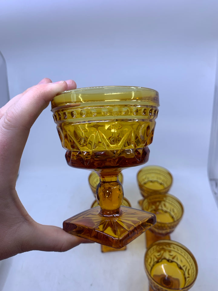 6 VTG FOOTED AMBER GLASSES W/ EMBOSSED DETAIL.