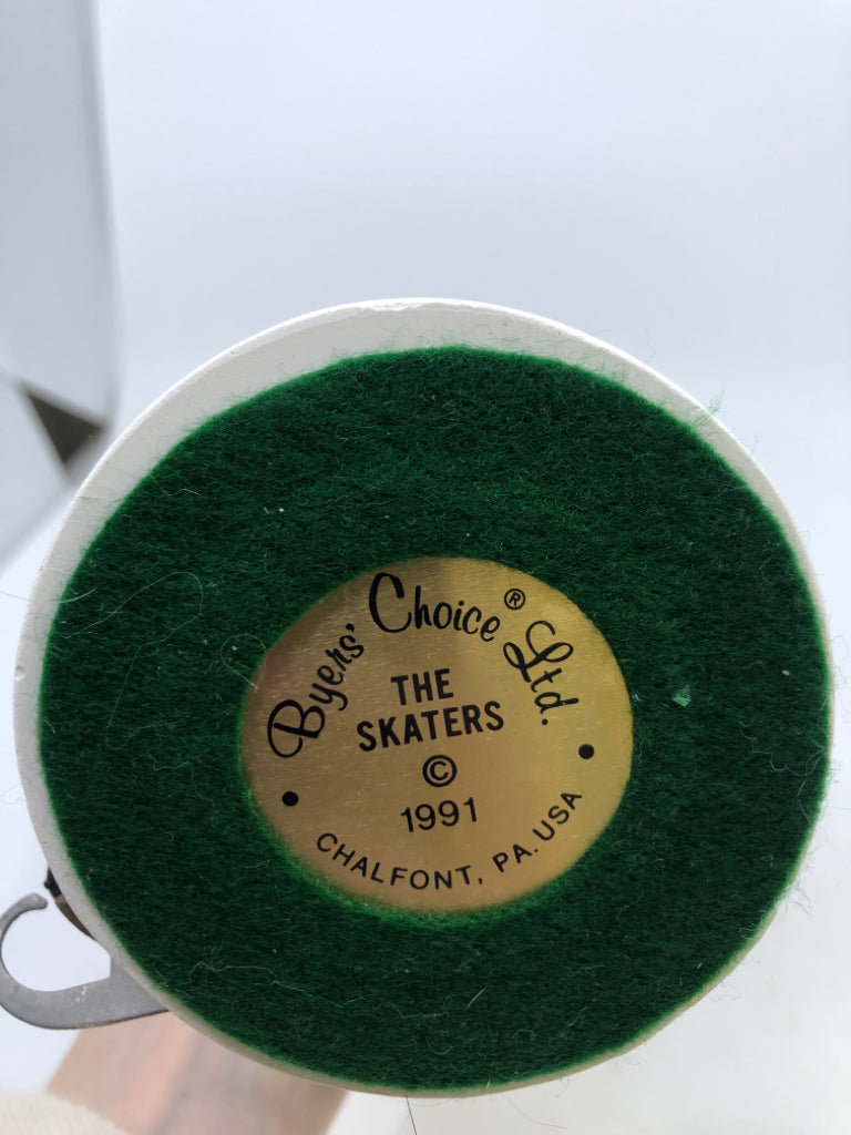 MAN IN GREEN COAT W/ SKATES "THE SKATERS" 1991 BRYERS CHOICE.