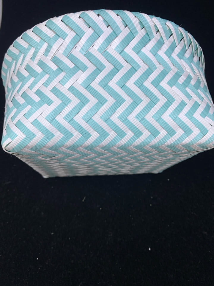 TEAL AND WHITE WOVEN BASKET.