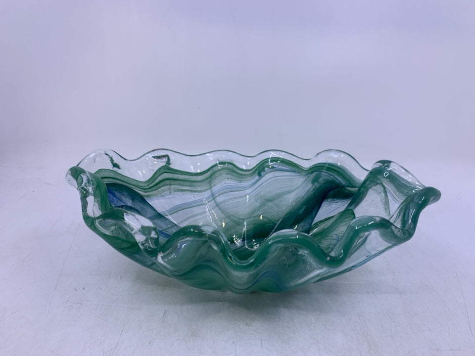 ABSTRACT OVAL GLASS W/ GREEN SWIRLS.