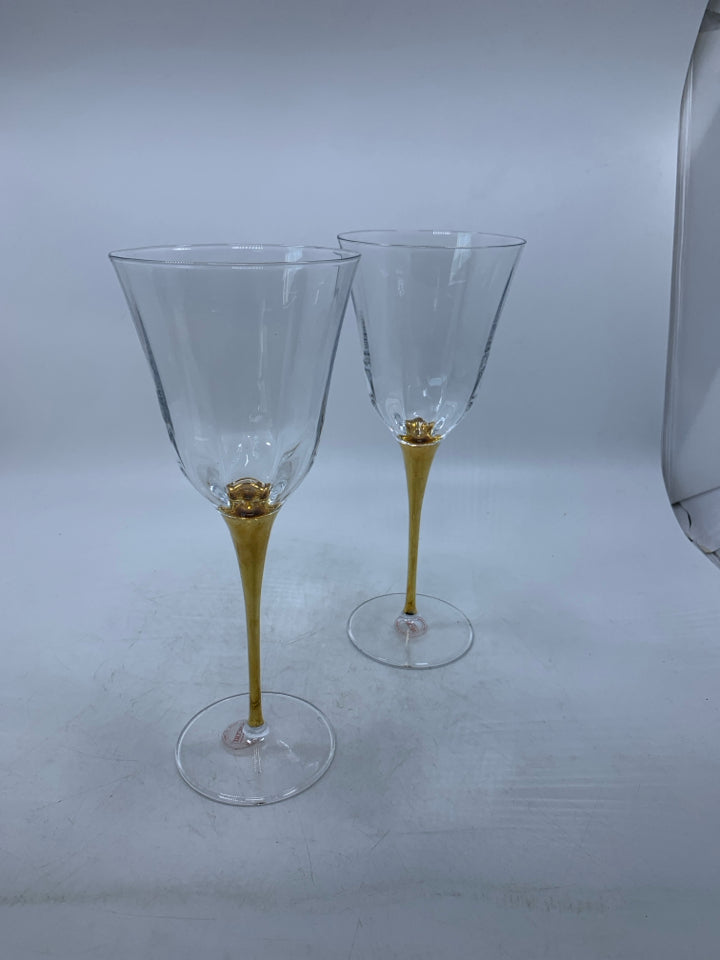 2 TALL GOLD STEM WINE GLASSES.
