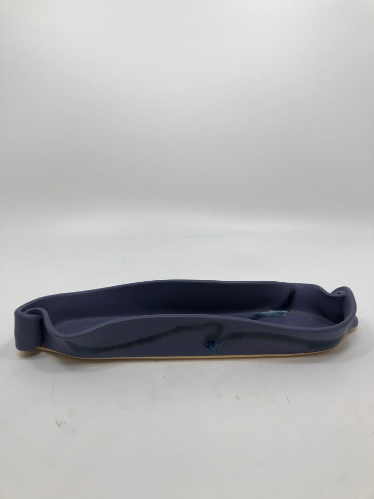 PURPLE STONEWARE DISH W/CURLED ENDS.
