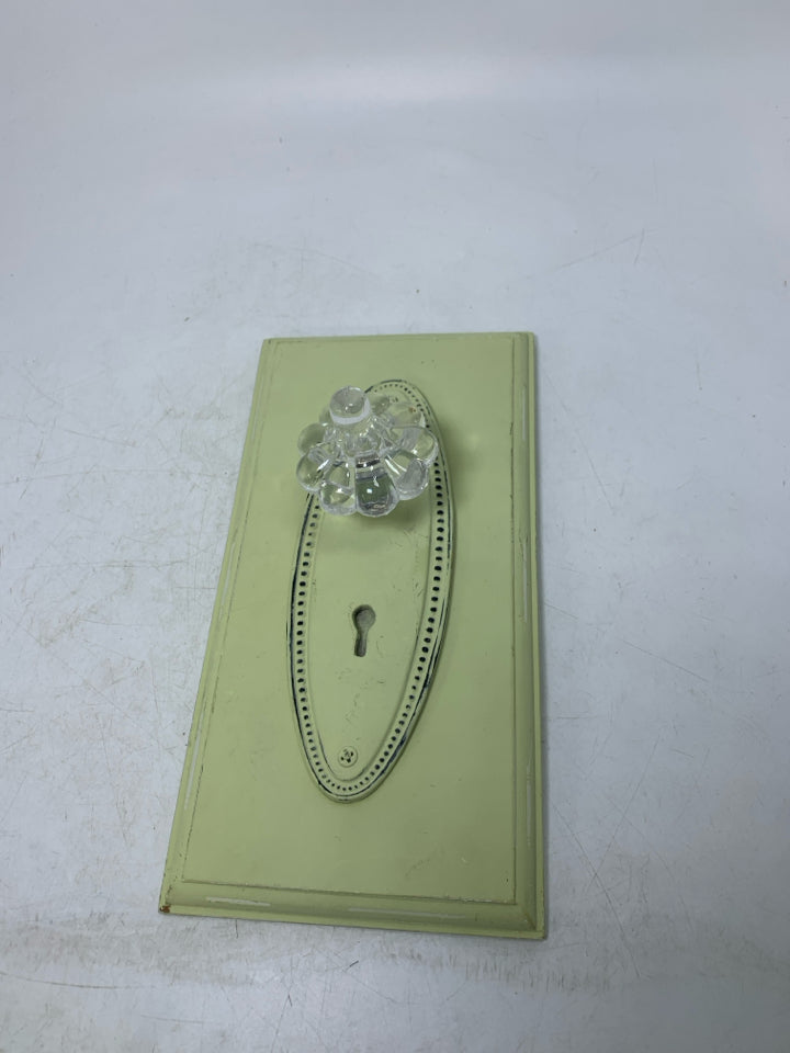LIME GREEN DOOR KNOB WALL HANGING.