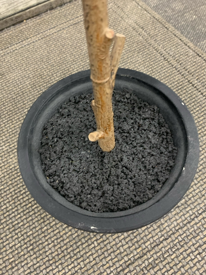 TALL FAUX PLANT IN BLACK PLANTER.