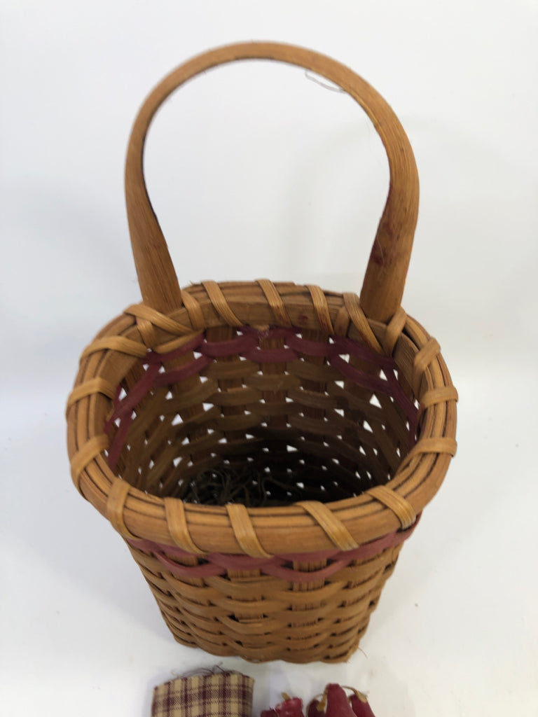 TALL BASKET W/ HANDLE, 6 RED CANDLES & NAPKIN.