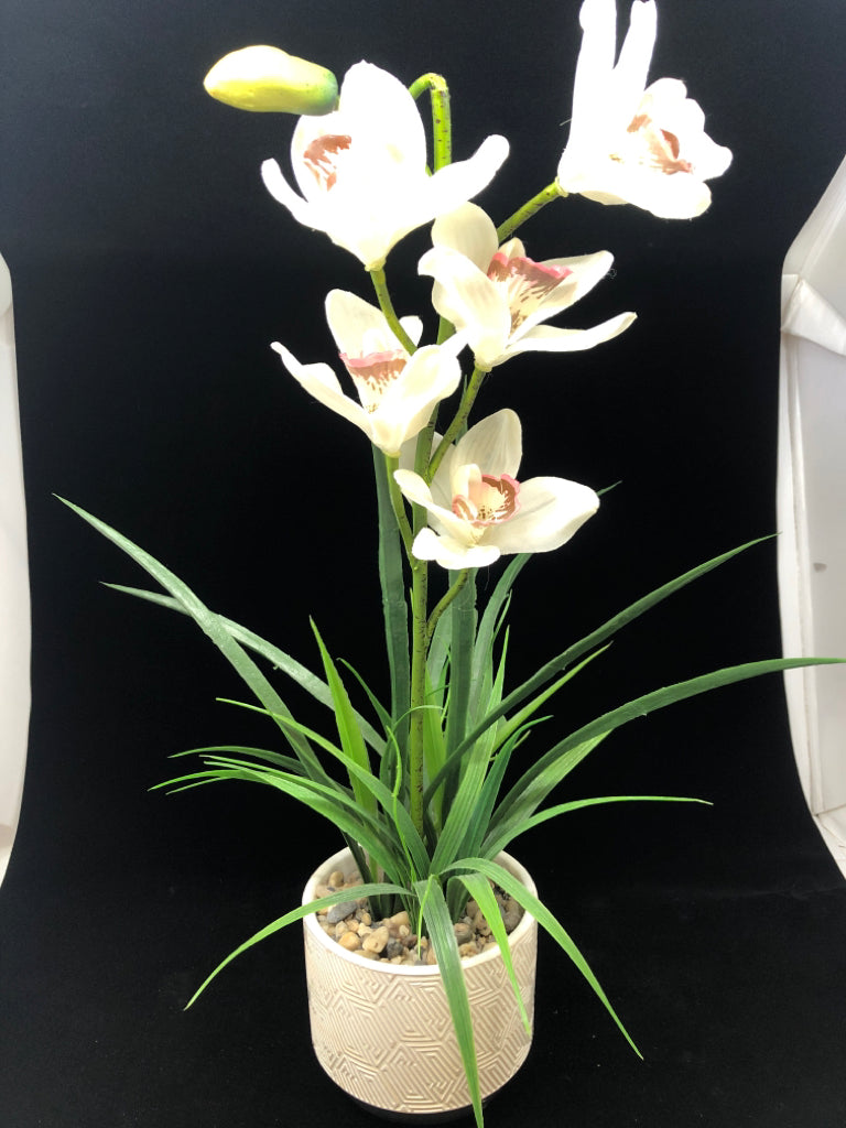 FAUX ORCHID IN TEXTURED CERAMIC PLANTER.