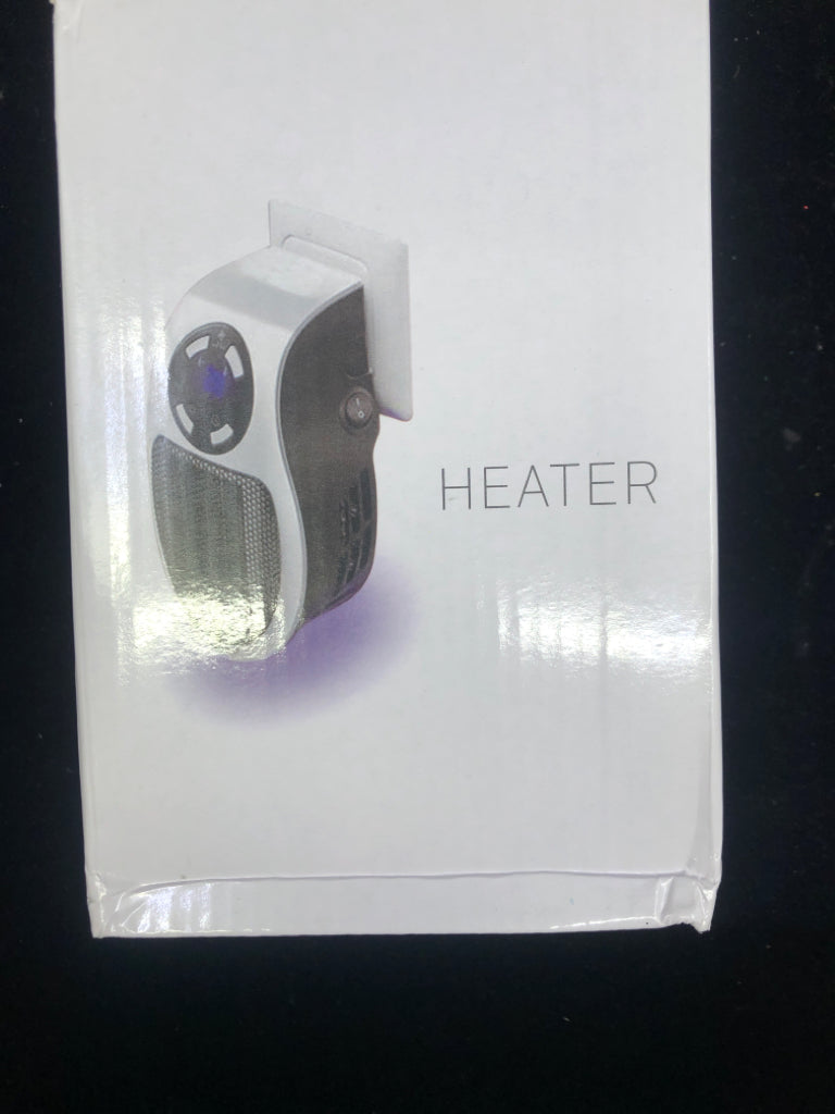 NIB PLUG IN HEATER.