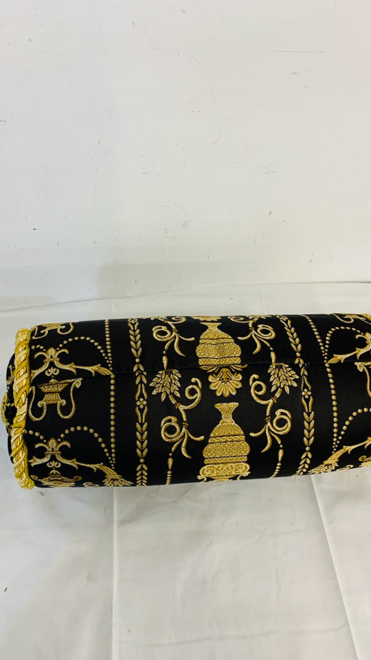 BLACK AND GOLD CYLINDER PILLOW.