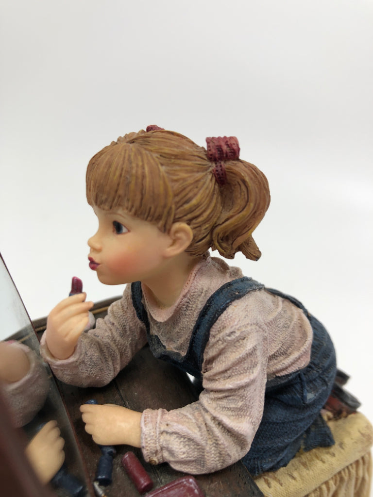RESIN GIRL FIGURINE APPLYING MAKEUP.
