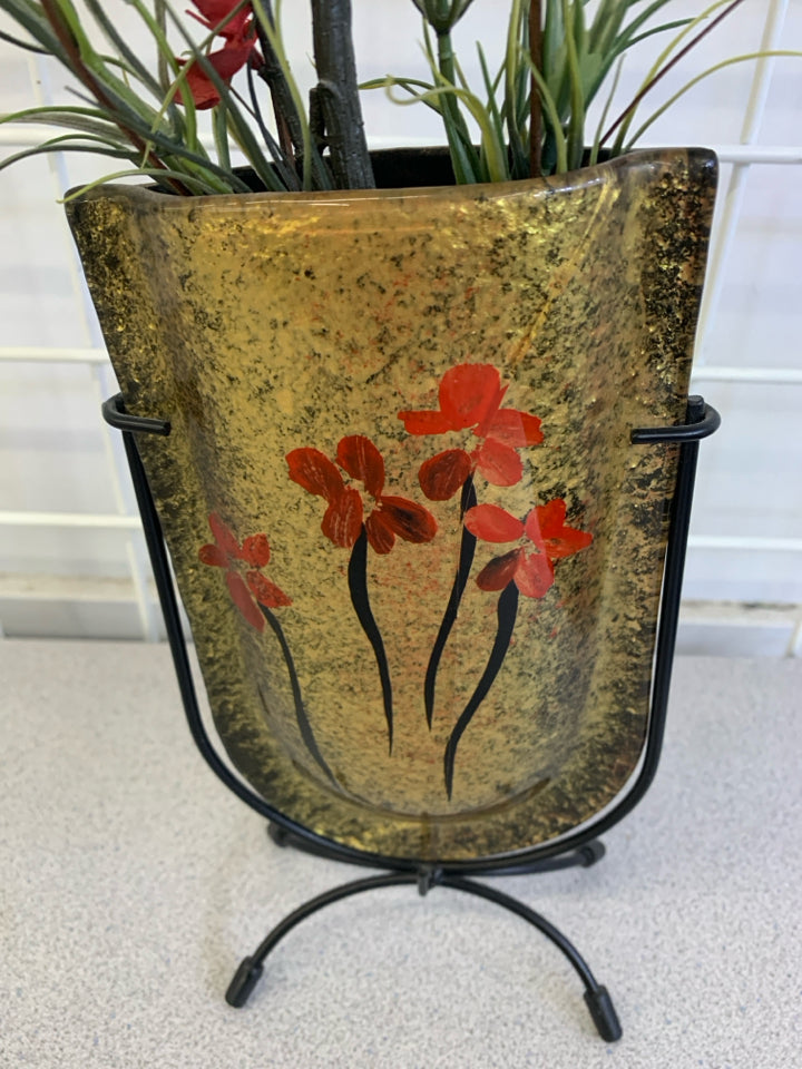 FAUX RED FLORALS IN POCKET VASE ON METAL STAND.