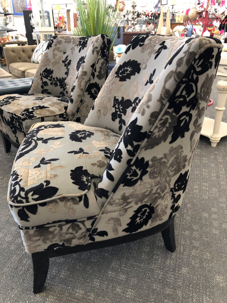 BLACK FLORAL UPHOLSTERED CHAIR W/ WOOD LEGS.