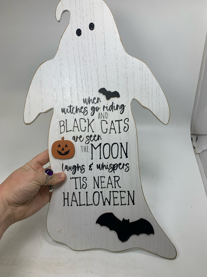 WHITE GHOST SHAPED  TIS NEAR HALLOWEEN SIGN.