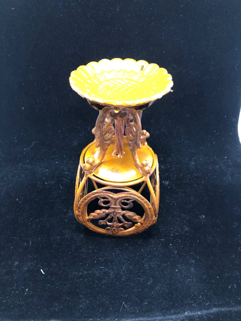 RUST COLORED METAL ORNATE PILLAR CANDLE HOLDER.