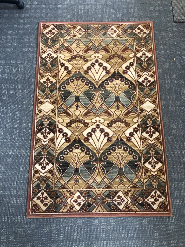 BROWN CHATHAM FLORAL RUG.