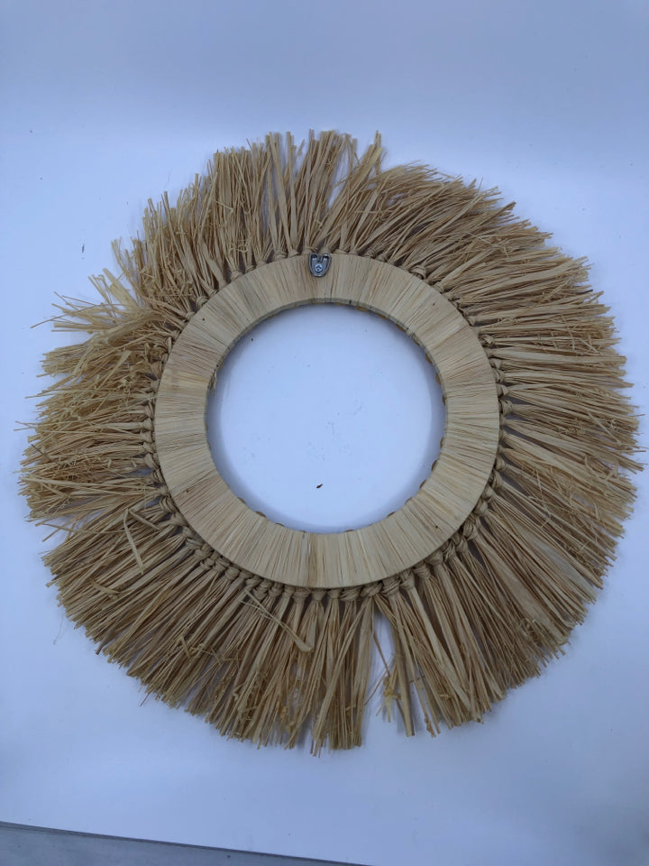 STRAW AND WOOD SUN WALL HANGING.