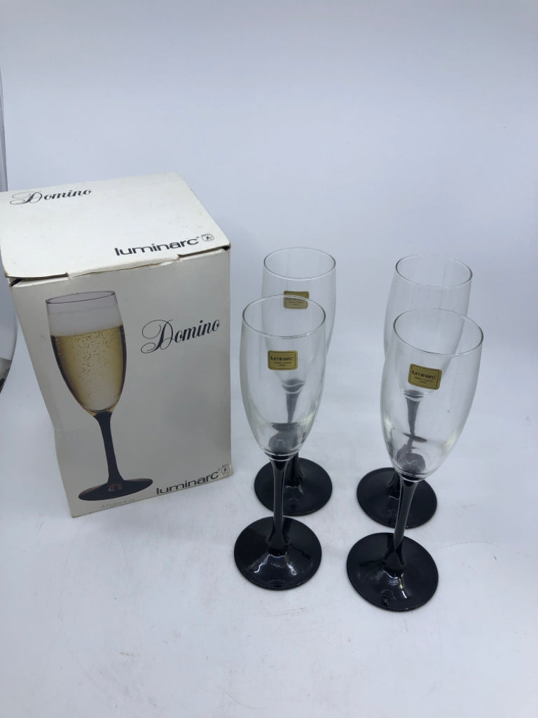 4 BLACK STEM CHAMPAGNE FLUTES W/BOX.