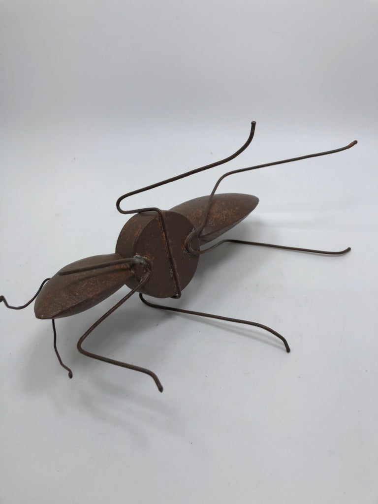 RUSTIC WELDED ANT CANDLE HOLDER.