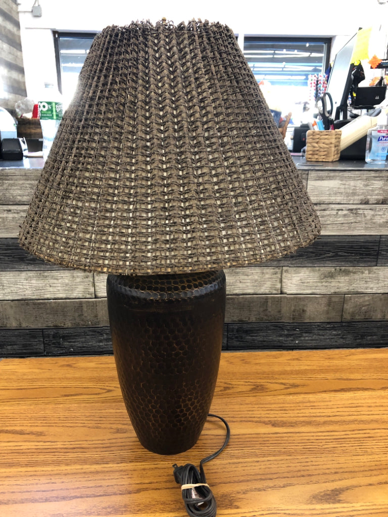 BRONZE BASE LAMP W/BROWN WICKER SHADE.