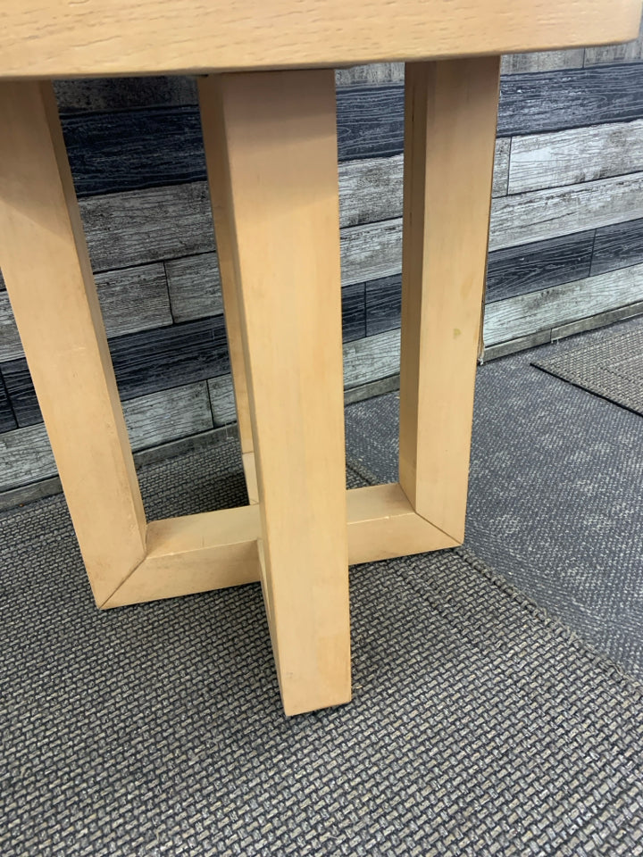 ROUND LIGHT WOOD SIDE TABLE.