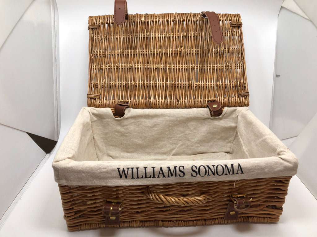 WOVEN BASKET W/FABRIC LINER AND FAUX LEATHER BUCKLES.