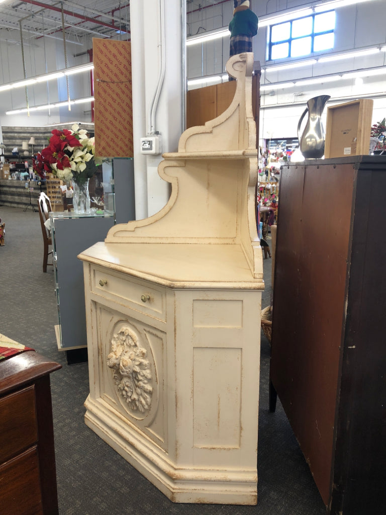 DISTRESSED CREAM CORNER HUTCH W DRAWER AND CABINET.