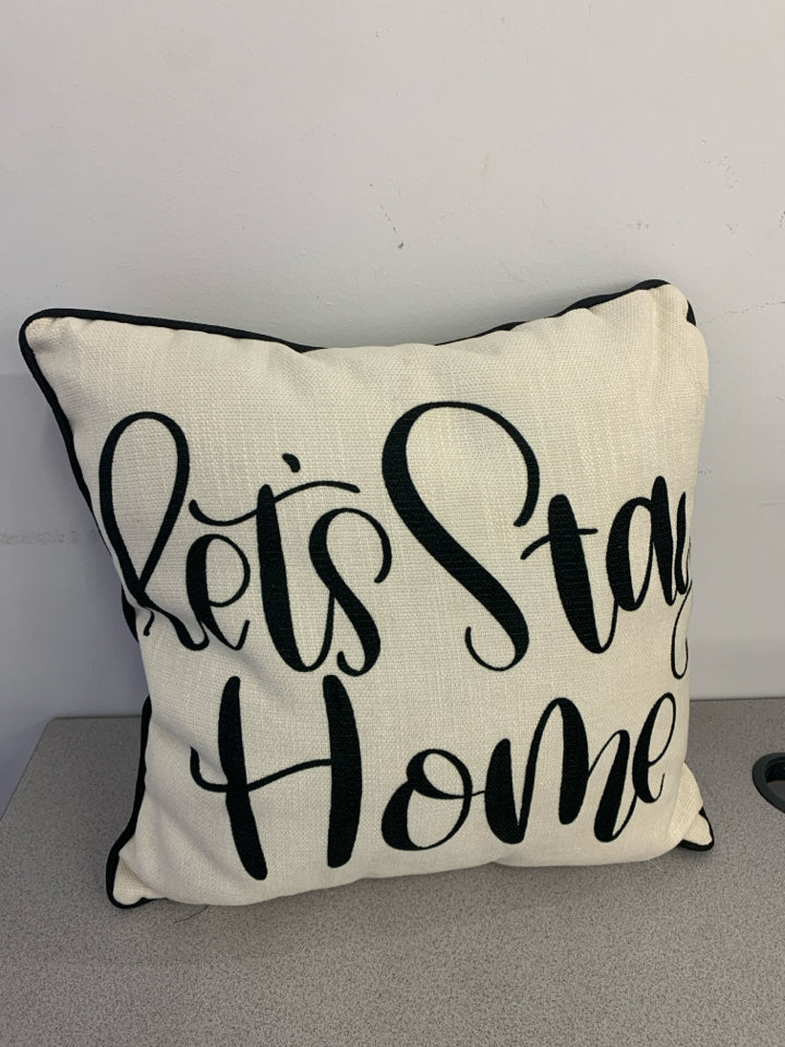 "LET'S STAY HOME" BLACK AND TAN SQUARE PILLOW.