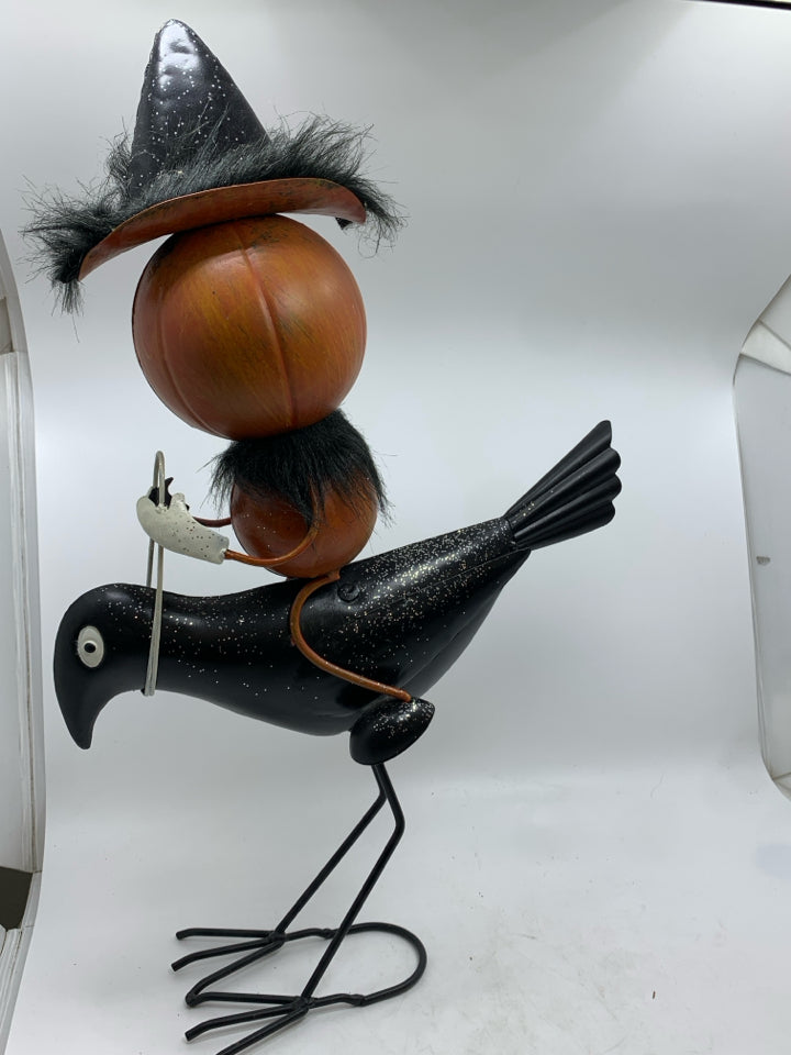 METAL PUMPKIN RIDING CROW DECOR.
