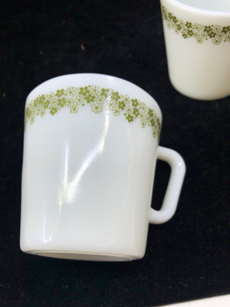 2 WHITE PYREX MUGS W GREEN FLOWERS.