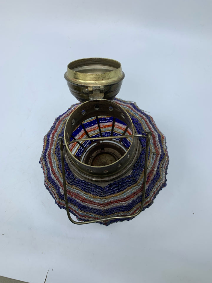 BRASS METAL W/ COLORFUL BEADED CENTER TEA LIGHT HOLDER.