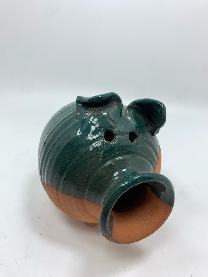 TERRA COTTA PIGGY BANK W/GREEN GLAZE.