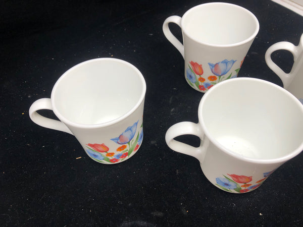 4 CORNING WARE BLUE AND PINK TULIP MUGS.