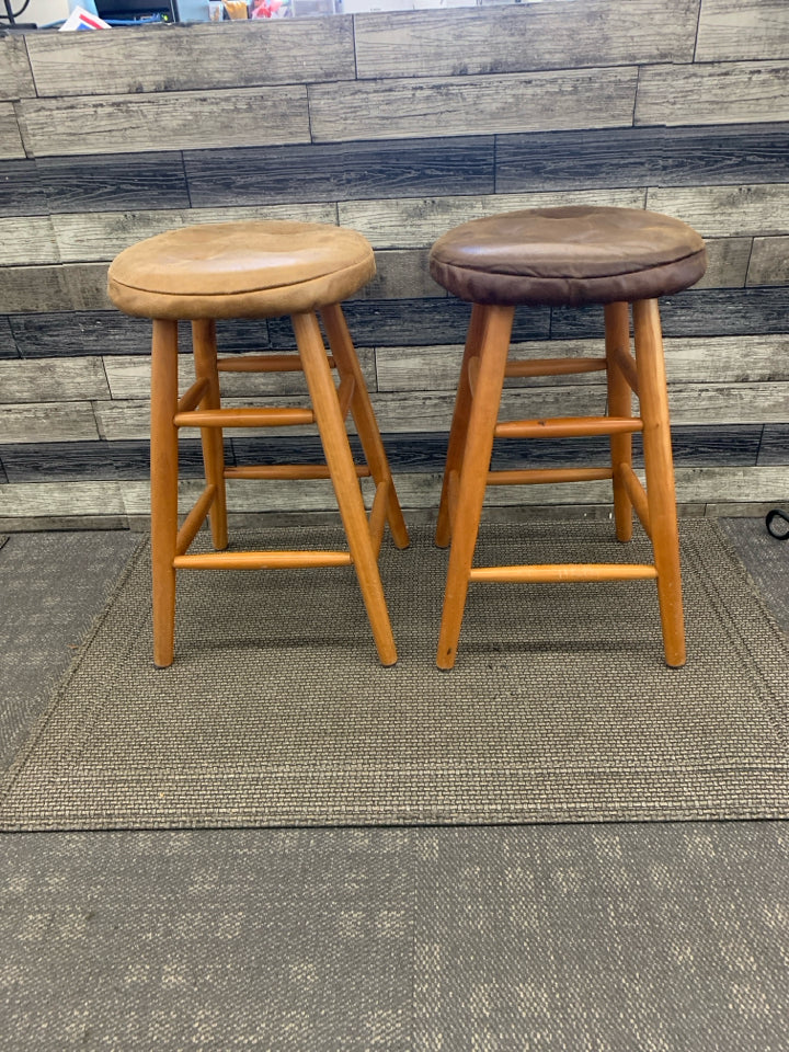 2 WOOD BAR STOOLS W FAUX LEATHER COVERS.