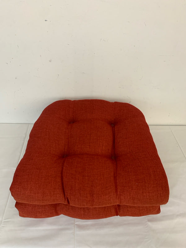 2 RED CHAIR CUSHIONS.