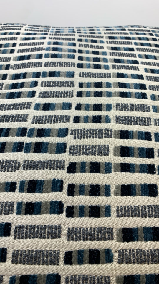MULTI-STITCHED BLUE ACCENT PILLOWS.