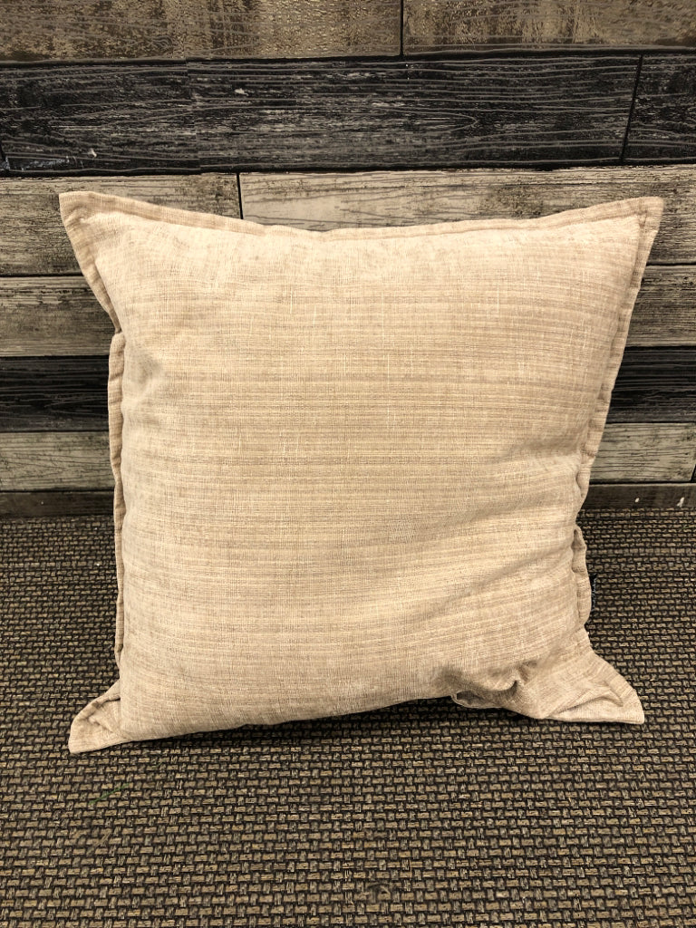 TAN AND CREAM PILLOW.