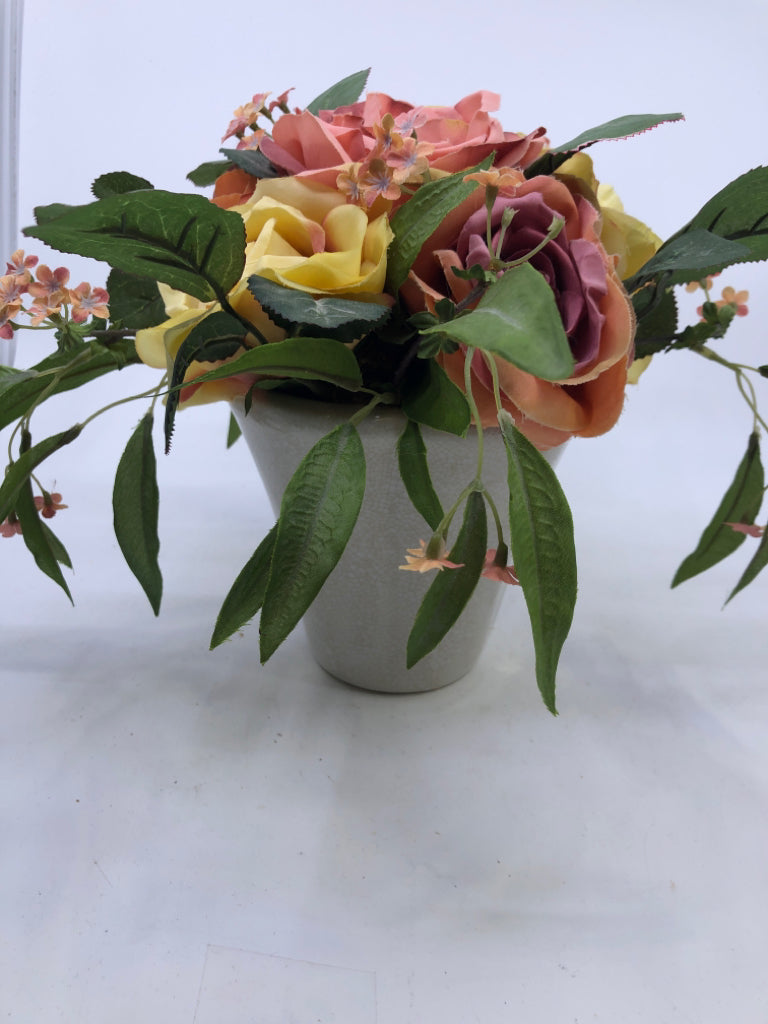 FAUX PINK YELLOW ROSES IN PLANTER.