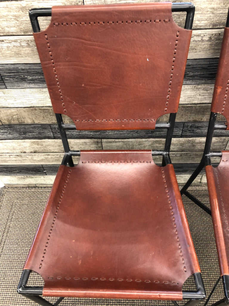 2 BROWN LEATHER CHAIRS CRATE & BARREL.