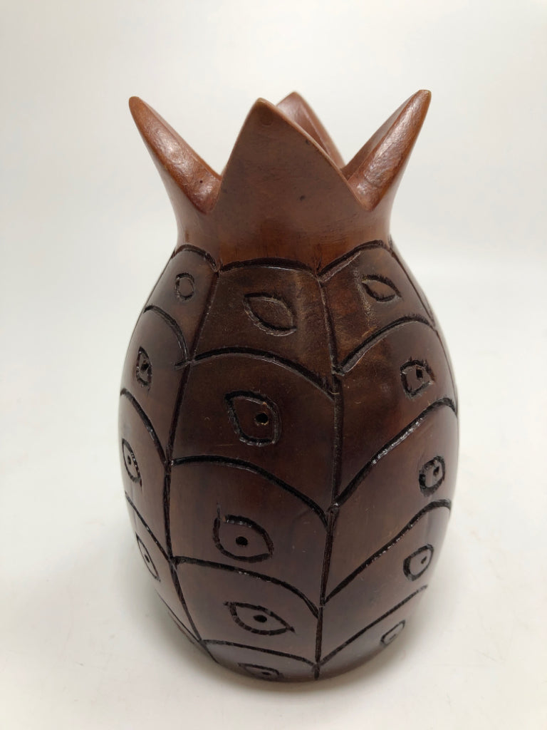 HAND-CARVED DARK WOOD PINEAPPLE CANDLE HOLDER.