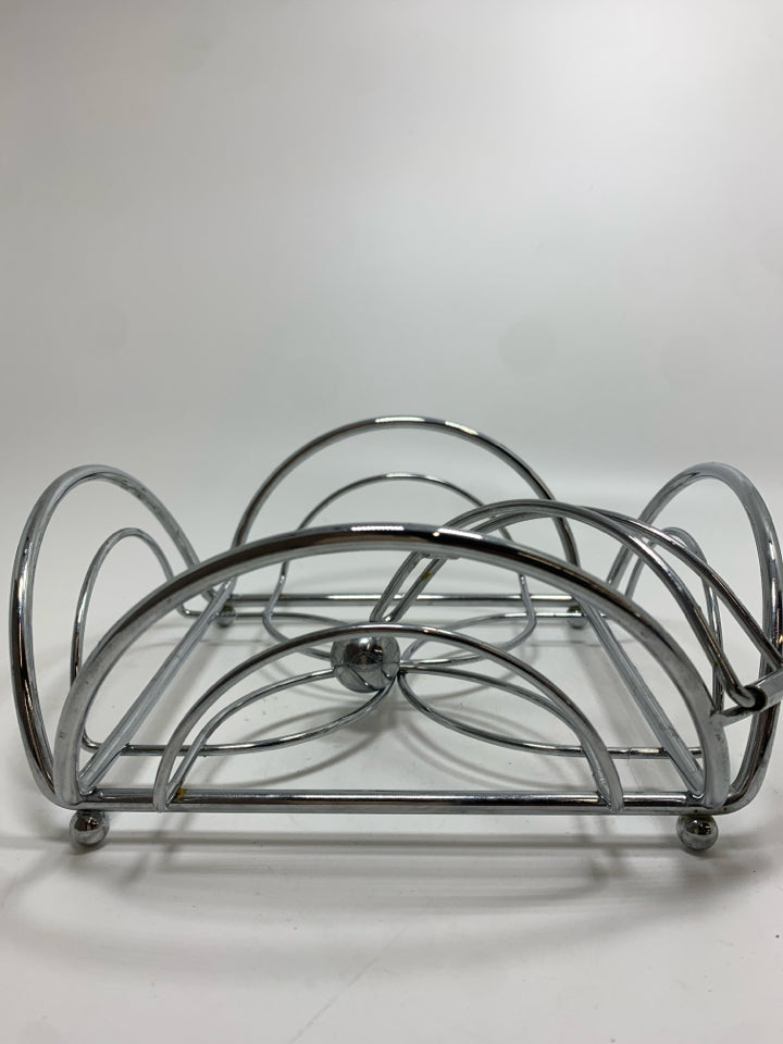 SILVER METAL NAPKIN HOLDER.