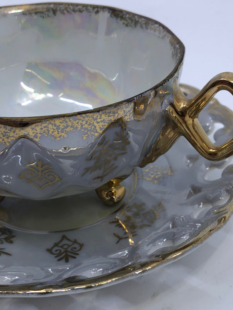 VTG LIGHT BLUE LACE PATTERN TEACUP AND SAUCER W GOLD ACCENTS.