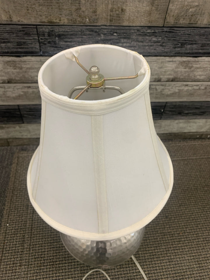 SILVER HAMMERED BASE LAMP W/ WHITE SHADE.
