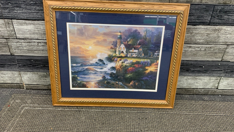 SUNSET BY LIGHTHOUSE FRAMED PRINT.