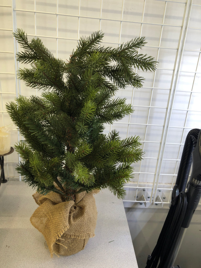 FAUX PINE TREE IN BURLAP PLANTER.