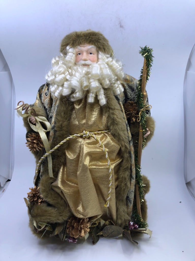 STANDING HOLLOW SANTA IN GOLD JACKET W/ PINECONES HOLDING STAKE.