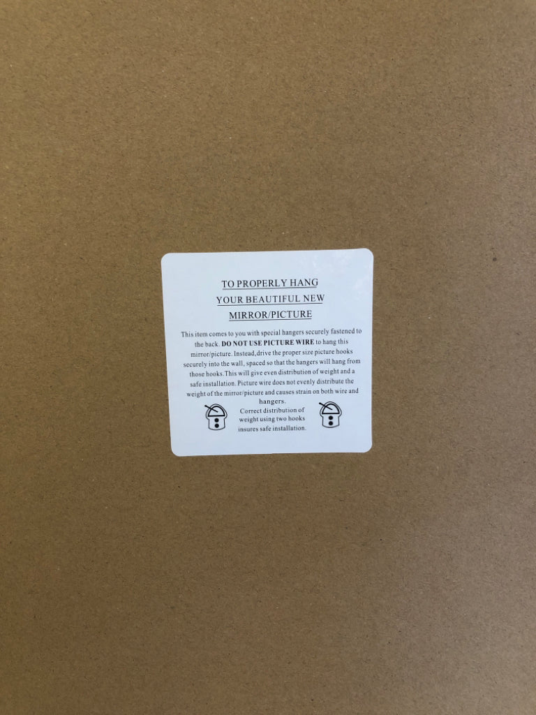 LARGE LEAF PHOTO IN LIGHT WOOD FRAME.