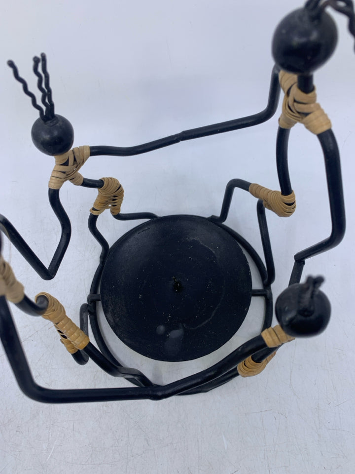 BLACK METAL 4 PEOPLE HOLDING HANDS PILLAR CANDLE HOLDER FOLK ART.