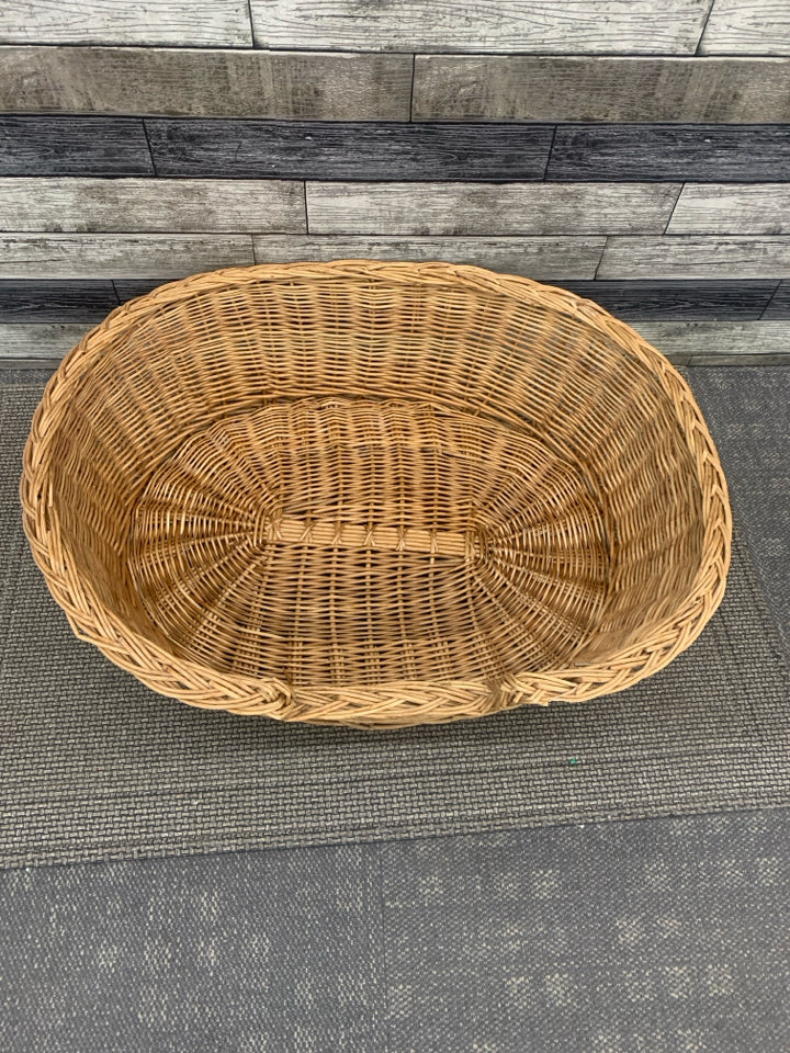 LARGE WICKER OVAL DOG BED.