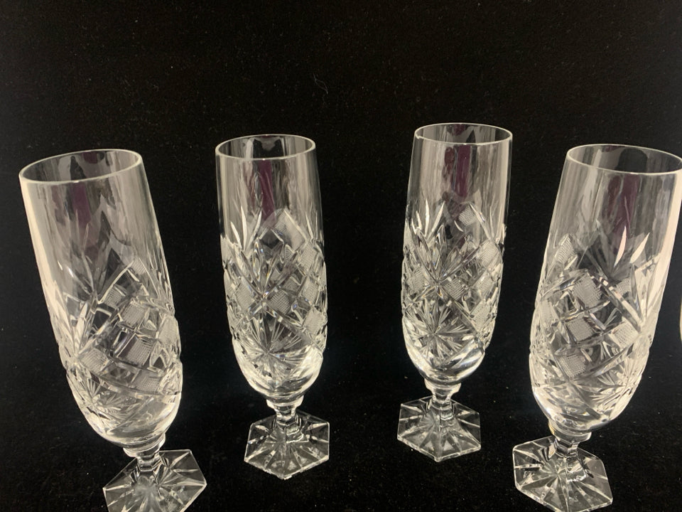 4 CUT GLASS CHAMPAGNE GLASSES.