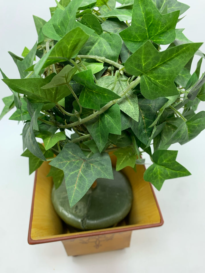 FAUX IVY TREE IN YELLOW METAL PLANTER.